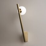Applique murale design dor�e ? torche & globe verre mesa