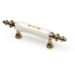 Poign�e pour meuble style classique en porcelaine finition blanche distance entre pointes : 64 mm mesures ...