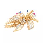 Broche fleur vintage diamants 0. 75 carat, rubis et saphirs et 2 ors 19. 76g Broche fleur vintage diamants 0. 75 carat, rubis et saphirs et 2 ors 19. 76g