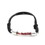 Bracelet rubis brut. couleur noir.