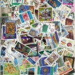 Tous pays 1000 timbres obliteres differents avec un album de stock pour timbres neuf