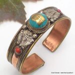Bracelet tibétain cuivre et kalachakra rouge Bracelet tibétain cuivre et kalachakra rouge