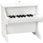 Piano blanc avec partitions blanc