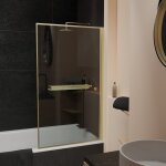 Pare baignoire rabattable 75x130cm en verre trempé - porte - serviette et etagère or doré brossé Pare baignoire rabattable 75x130cm en verre trempé - porte - serviette et etagère or doré brossé