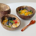Bol en bois en coquille de noix de coco, yaourt, céréales, fruits, pêche, petit déjeuner, bol en bois ... Bol en bois en coquille de noix de coco, yaourt, céréales, fruits, pêche, petit déjeuner, bol en bois ...