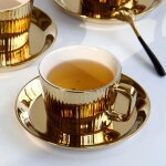 Ensemble de tasses et soucoupes a thé / café en céramique plaqué or, 1 ensemble, tasse a expresso en ... Ensemble de tasses et soucoupes a thé / café en céramique plaqué or, 1 ensemble, tasse a expresso en ...