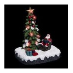 Village de no�l lumineux p�re no�l dans son fauteuil autour d'un sapin