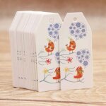 Etiquette volante de couleur blanche, oiseau avec fleur, impression d'un ct, montre le dpart de l'hiver, ...