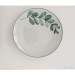 4 assiettes blanches et vertes en porcelaine