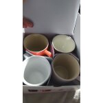4 tasses a cafe, neuves, dans son carton d'emballage. marque le creuset. jamais utilisees