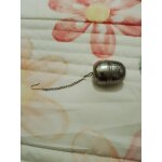 Boule a th argente en acier inoxydable vintage annes 90.