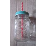 Mug en verre avec paille et couvercle.