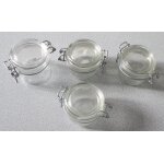 Quatre petits bocaux en verre et fermeture métallique vendus vides - 3 de hauteur 6. 5cm - diamètre 8cm ... Quatre petits bocaux en verre et fermeture métallique vendus vides - 3 de hauteur 6. 5cm - diamètre 8cm ...