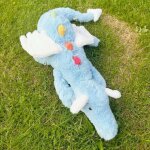 Dessin anim ciel arc - en - ciel dragon en peluche poupe couche bleu petit dragon volant saisir machine ...