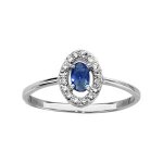 Bague argent rhodi forme ovale verre bleu fonc entourage oxydes blancs sertis