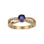 Bague plaqué or croisée pierre centrale bleue et pierres blanches serties Bague plaqué or croisée pierre centrale bleue et pierres blanches serties