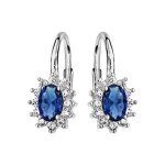 Boucles d'oreilles argent rhodi dormeuse au centre perle bleue et contour oxydes blancs sertis