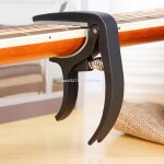 Capodastre de guitare acoustique réglable, mobile, en nylon et silicone, 4 cordes, 6 cordes, pour accorder ... Capodastre de guitare acoustique réglable, mobile, en nylon et silicone, 4 cordes, 6 cordes, pour accorder ...