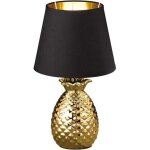 Lampe ananas r�aliste sur la table, dor�e lampe d'�tabli