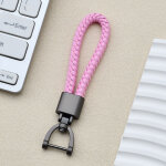 Porte - cl�s rose pour voiture avec cordon en cuir tress� et fermoir en forme de fer � cheval, unisexe ...