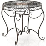 Clp - table ronde avec un style romantique orn� de diff�rentes d�corations de couleurs colore : bronze ...