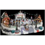 Village de no�l lumineux et musical avec patinoire blanche et sc�ne de vie illumin�e sur piste de patin ...