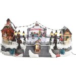 Village de nol lumineux et musical avec patinoire blanche et scne de vie illumine sur piste de patin ...