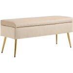 Banquette coffre style art déco - piètement incliné effilé acier doré assise velours beige Banquette coffre style art déco - piètement incliné effilé acier doré assise velours beige