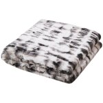 Linnea - plaid en polyester 140x200 cm nina fausse fourrure bicolore noir et blanc