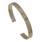 Bracelet plaqu or demi jonc plat et un strass