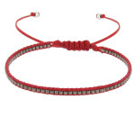 Les poulettes bijoux - bracelet perles argent�es lien tr�ss� rouge
