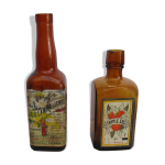 2 bouteilles en verre ambré avec leurs anciennes étiquettes 2 bouteilles en verre ambré avec leurs anciennes étiquettes