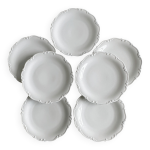 7 assiettes anciennes en porcelaine blanche