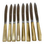 8 couteaux manches baklite