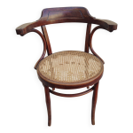 Chaise  accoudoirs canne attribue  fischel