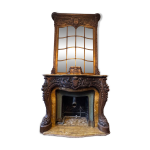 Cheminée en marbre et son trumeau en bois sculpté Cheminée en marbre et son trumeau en bois sculpté