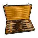 Coffret complet de 12 couteaux de table inox manches baklite viroles art dco