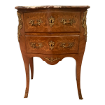 Commode galbe en bois de placage de style louis xv / xx sicle