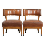 Ensemble de 2 fauteuils / canap�s au design vintage en cuir de peau de mouton.