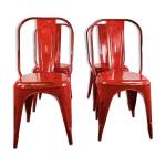 Ensemble de quatre chaises basses en acier rouge