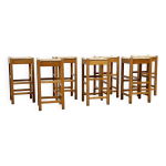 Ensemble de sept tabourets de bar en rotin et bois