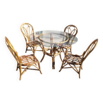 Ensemble vintage table ronde en rotin et verre et 4 chaises en rotin Ensemble vintage table ronde en rotin et verre et 4 chaises en rotin