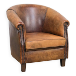 Fauteuil club vintage en cuir de mouton  l'aspect plein de caractre