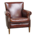 Fauteuil confortable et bien fini en cuir de mouton de couleur fonce