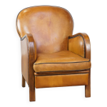 Fauteuil en cuir de mouton marron et clous de tapissier