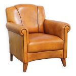 Fauteuil en cuir de mouton et passepoil marron fonc�