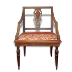 Un fauteuil du début du xxème siècle en bois naturel. Un fauteuil du début du xxème siècle en bois naturel.