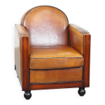 Fauteuil design art dco en cuir de mouton et bois avec pieds boule