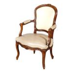 Fauteuil d poque louis xv en bois naturel  dossier cabriolet sculpt de fleurettes