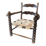 Fauteuil vintage en bois tourné, assise graphique Fauteuil vintage en bois tourné, assise graphique